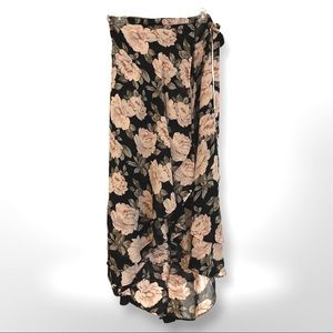 Reformation wrap skirt with high/low cut with ruffles.